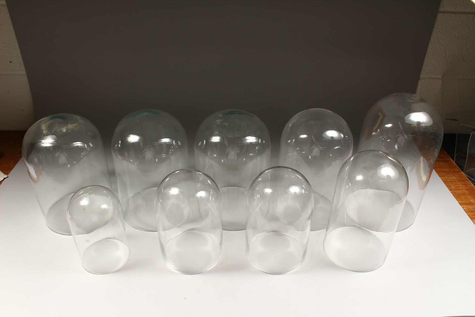 A COLLECTION OF 9 GLASS DOMES. 14ins to 8ins high. - Image 3 of 4