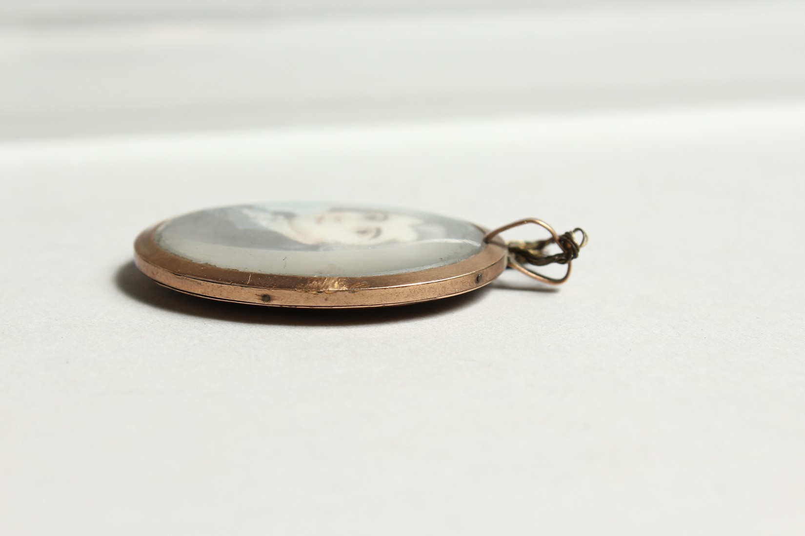 A GEORGIAN OVAL MINIATURE OF A YOUNG MAN, the reverse with plated hair. 1.25ins x1.25ins - Image 4 of 5