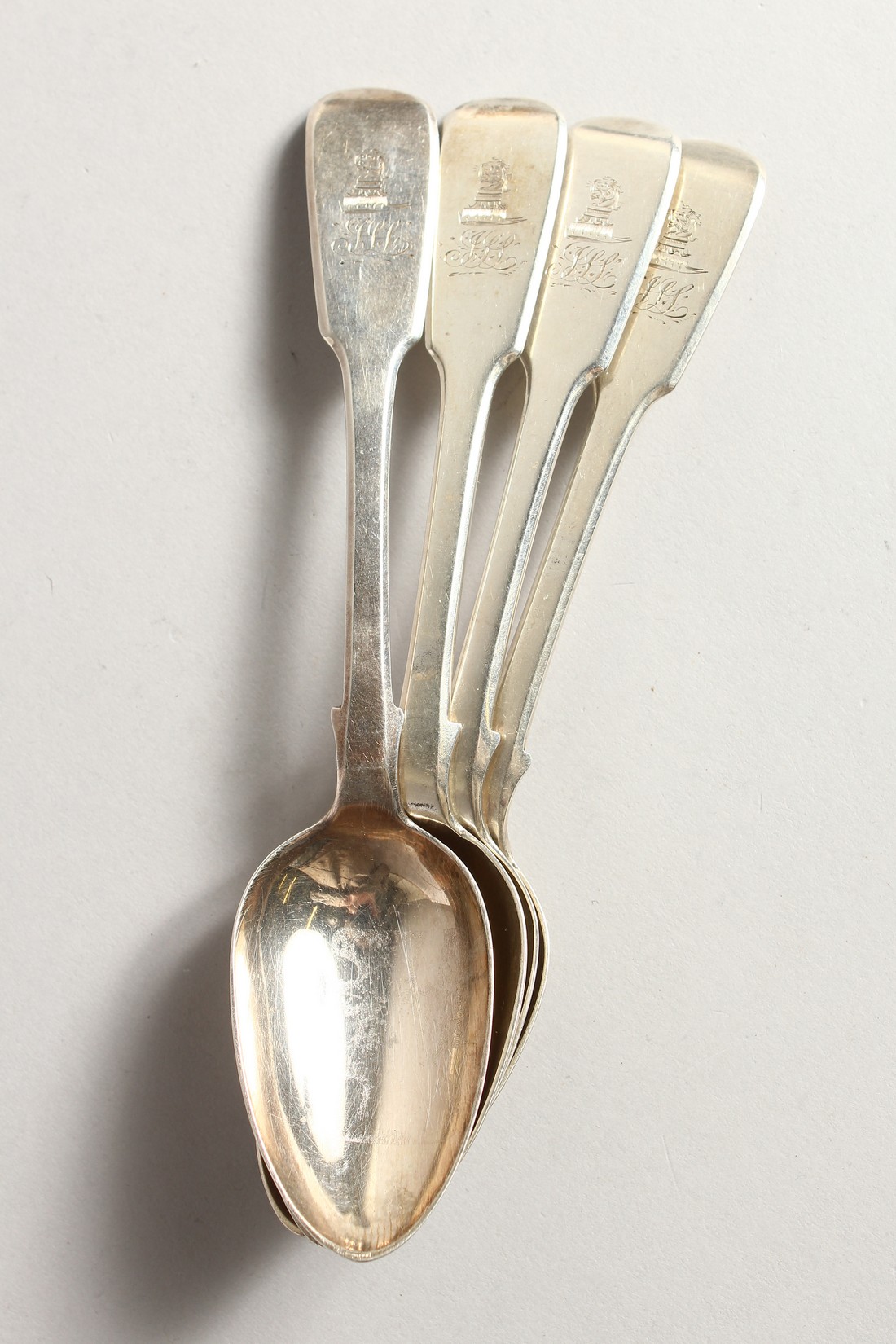 A SET OF FOUR WILLIAM IV SILVER FIDDLE PATTERN DESSERT SPOONS. Chester 1838, maker J.S. Weighs