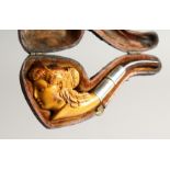 A SMALL MEERSCHAUM PIPE head of a lady in a leather case. 4.25ins