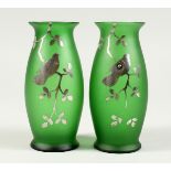A PAIR OF SILVER OVERLAY GLASS VASES with song birds. 5.5ins high.