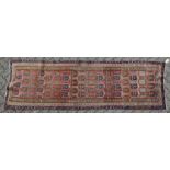 A GOOD PERSIAN RUNNER, rust ground with all over Botch decoration. 9ft 2ins x 2ft 10ins.