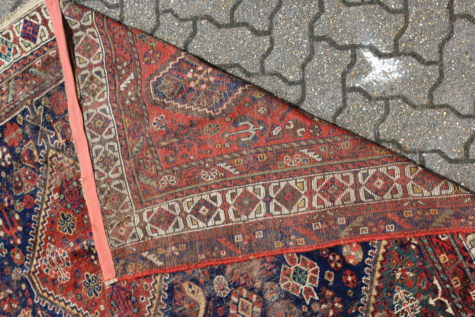 A PERSIAN CARPET with three large diamond design, in red and blue. 9ft long x 6ft 10ins wide. - Image 2 of 2
