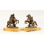 A SMALL PAIR OF ITALIAN BRONZE MARLEY HORRSES AND ATTENDANTS on marble base. 6ins high
