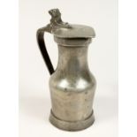 A NORMANDY PEWTER LIDDED JUG 9ins high.