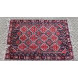A LARGE PERSIAN CARPET with twenty main medallions 10ft long x 6ft 6ins wide.