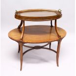 A GOOD MAHOGANY OVAL TWO TIER TABLE with detatchable two handled glass tray on curving support