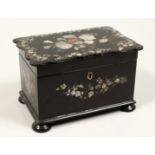 A GOOD VICTORIAN BLACK PAPIER MACHE TWO DIVISION TEA CADDY inlaid with mother of pearl on bun