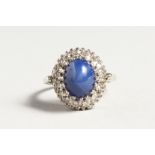 A GOLD CARBOUCHON SAPPHIRE AND DIAMOND RING