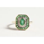 A 9CT GOLD EMERALD AND DIAMOND DECO STYLE RING