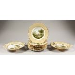 A SET OF 9 19TH CENTURY LANDSCAPE PLATES with beige border with landscape scenes wih castles and