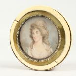 A GEORGIAN IVORY CIRCULAR BOX, the top painted with a portrait of Lady Mary Onslow. 3.75ins