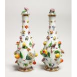 A GOOD PAIR OF MEISSEN FLOWER AND FRUIT ENCRUSTED VASES AND COVERS. Cross swords mark in blue. 10.