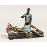 A PAINTED BRONZE OF A MAN, lifting up a sleeping woman's skirt. 7 ins long