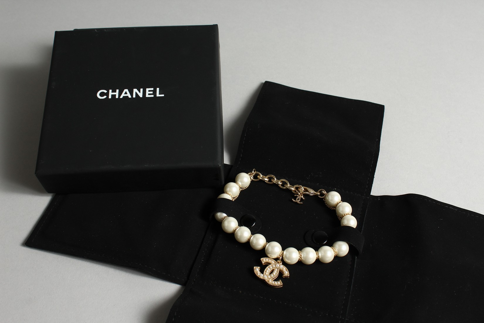 A CHANEL STYLE PEARL AND ENTWINED C BRACELET in a Chanel box - Image 5 of 6