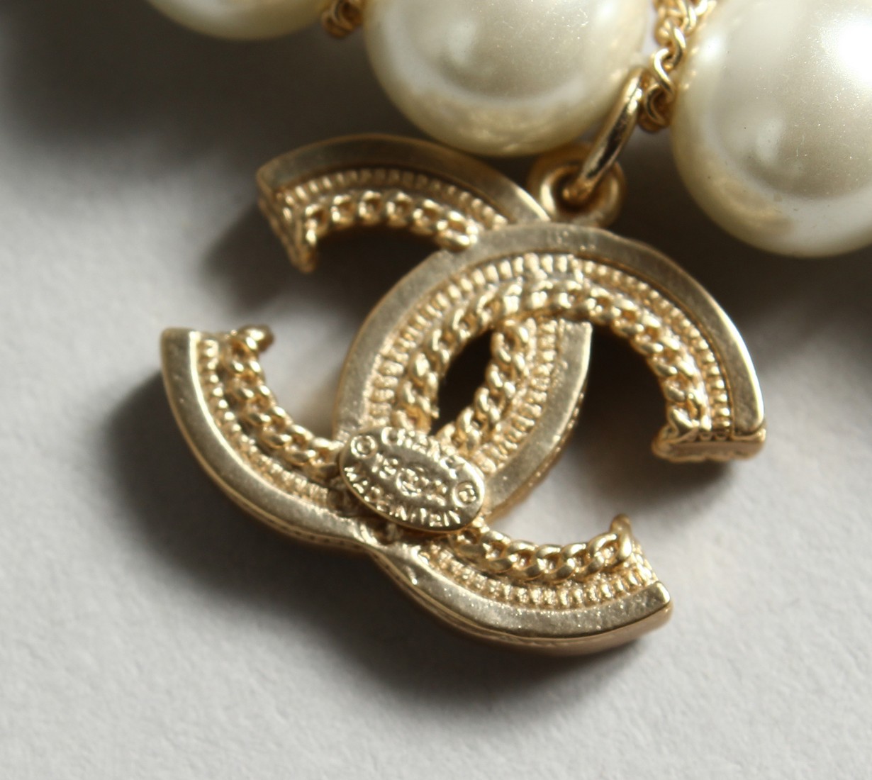 A CHANEL STYLE PEARL AND ENTWINED C BRACELET in a Chanel box - Image 4 of 6