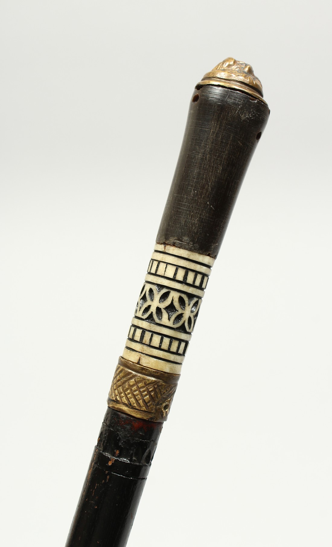 AN INDIAN BONE INLAID SWORD STICK. 23ins long.