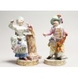 A GOOD PAIR OF MEISSEN PORCELAIN FIGURES a boy holding a hobby horse and a young girl with a doll.