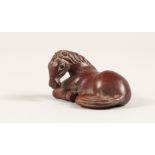 A JAPANESE CARVED WOOD HORSE NETSUKE Signed