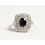 A SUPERB 18CT WHITE GOLD SAPPHIRE AND DIAMOND CLUSTER RING.