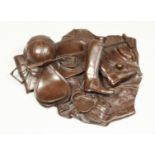 G.P.K. A BRONZE GROUP- HAT, BOOTS, POLO STICK ETC., monogrammed G.P.K. 86. 12ins across.