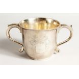 A GEORGE I SILVER CAUDLE CUP with leopard handles. 4.5ins diameter, London 1718 Weighs 10ozs.