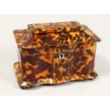 A GOOD REGENCY BLOND TORTOISESHELL TWO DIVISION TEA CADDY on four bun feet. 7.5ins wide.