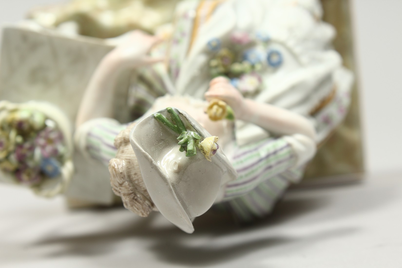 A GOOD MEISSEN PORCELAIN GROUP 'SENSE AND SMELL', a young lady sitting beside a table smelling - Image 8 of 13