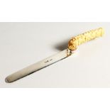 A SILVER LETTER OPENER with carved bone Chinese handles. 10 ins long, London 1804.
