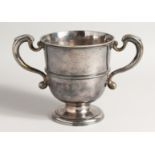 A FINE GEORGE I SILVER TWO HANDLED PEDESTAL CUP with scrolled handles, 6ins high, 5.25 ins