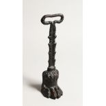 A CAST IRON CLAW DOOR STOP 13.5ins high.