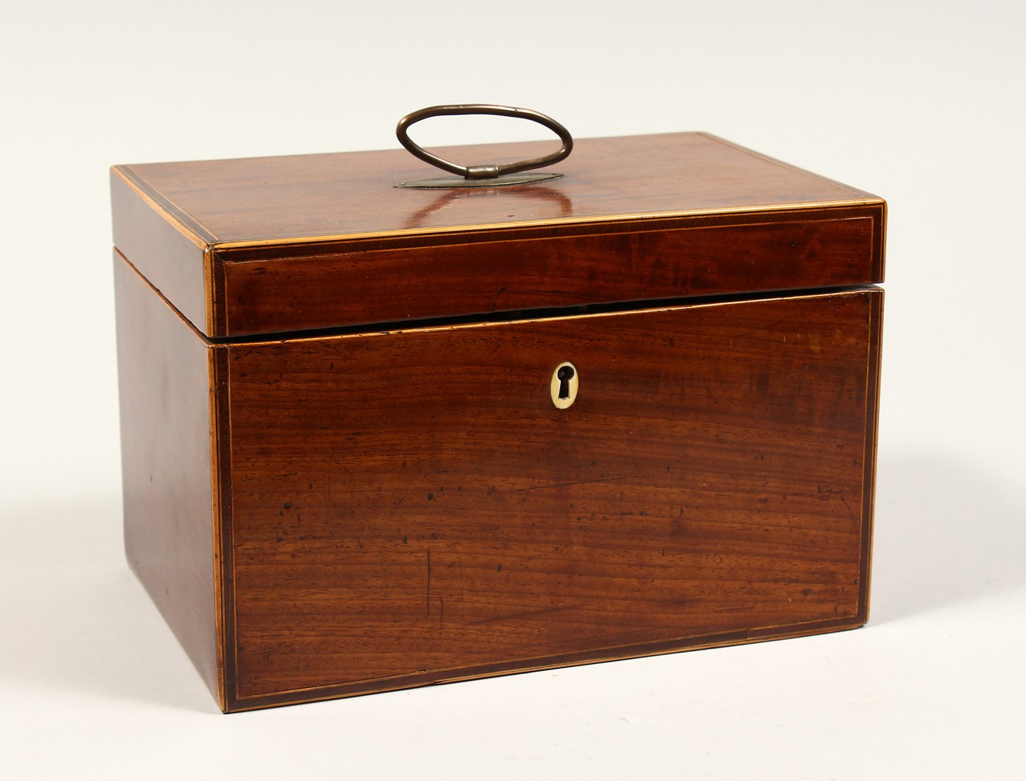 A GEORGE III MAHOGANY TEA CADDY with mixing bowl and tea cannister. 8.5ins long.