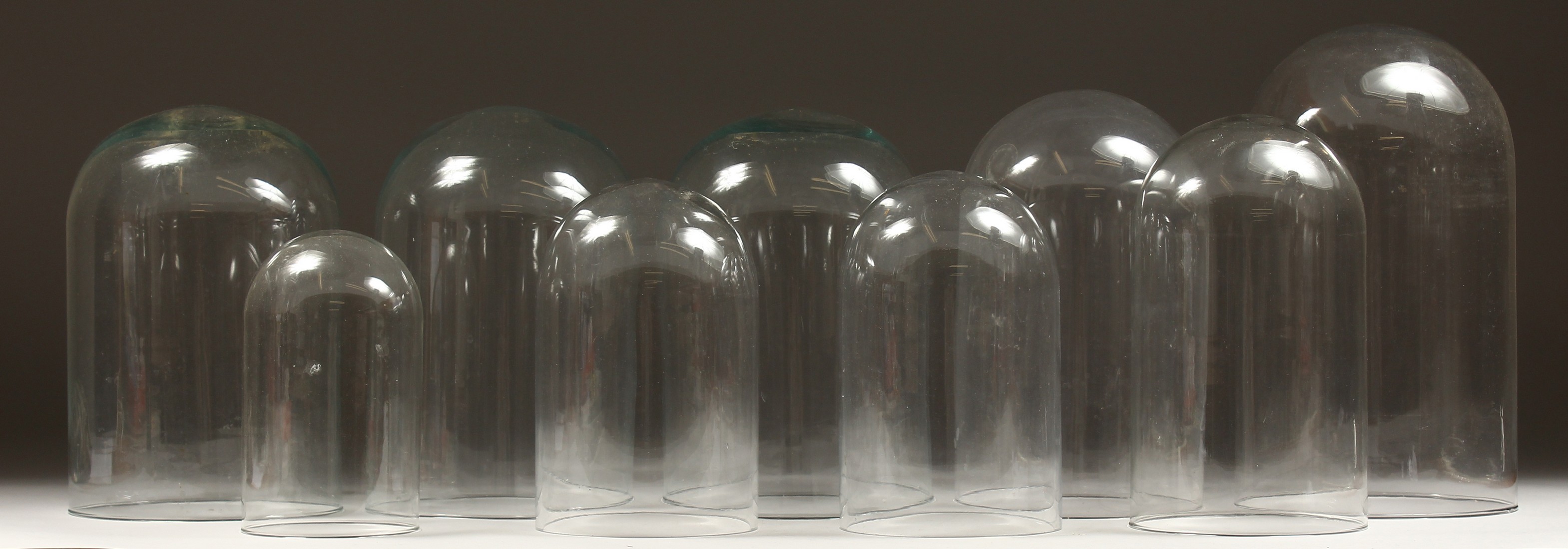 A COLLECTION OF 9 GLASS DOMES. 14ins to 8ins high. - Image 2 of 4