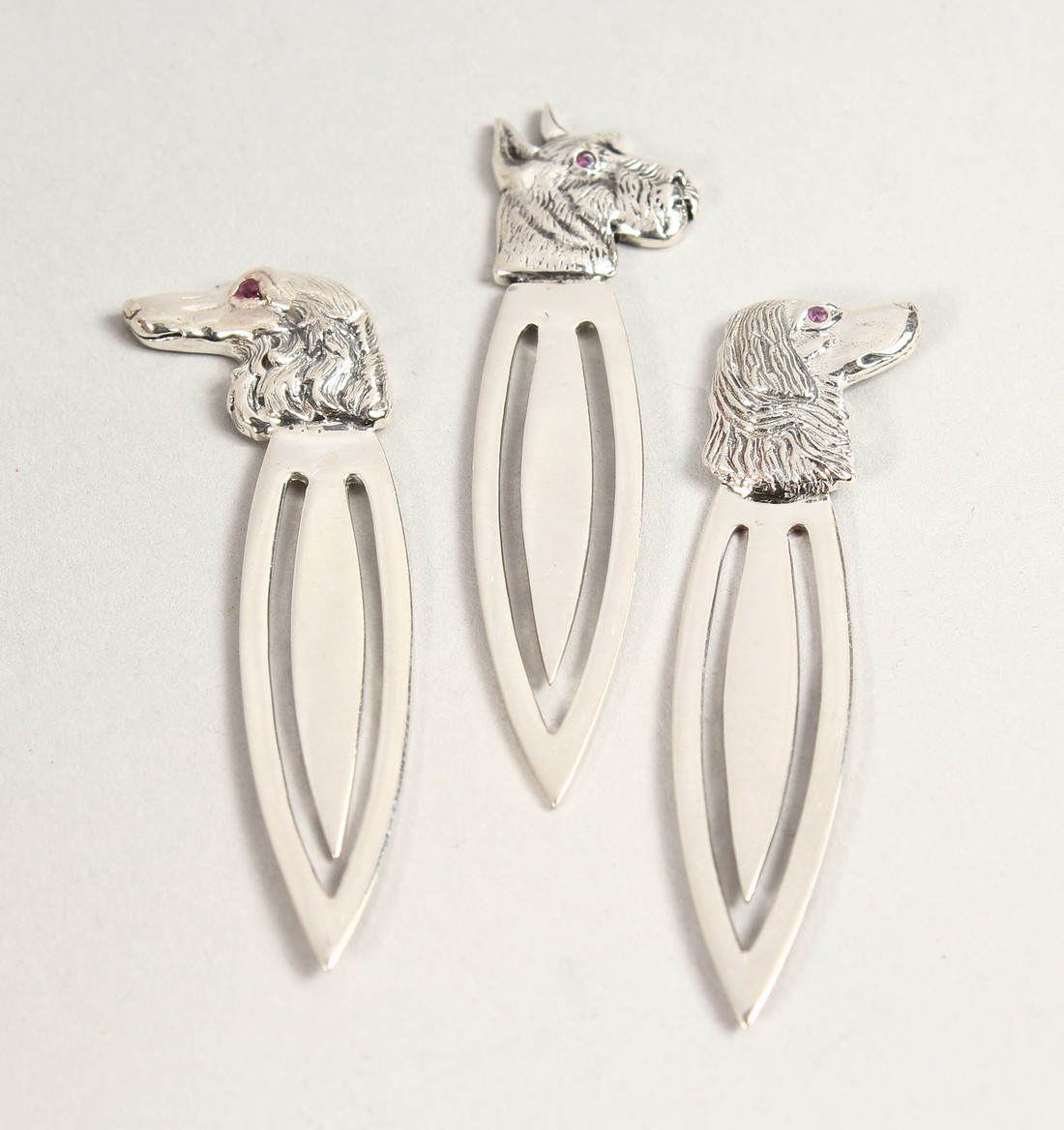 THREE NOVELTY SILVER BOOK MARKS