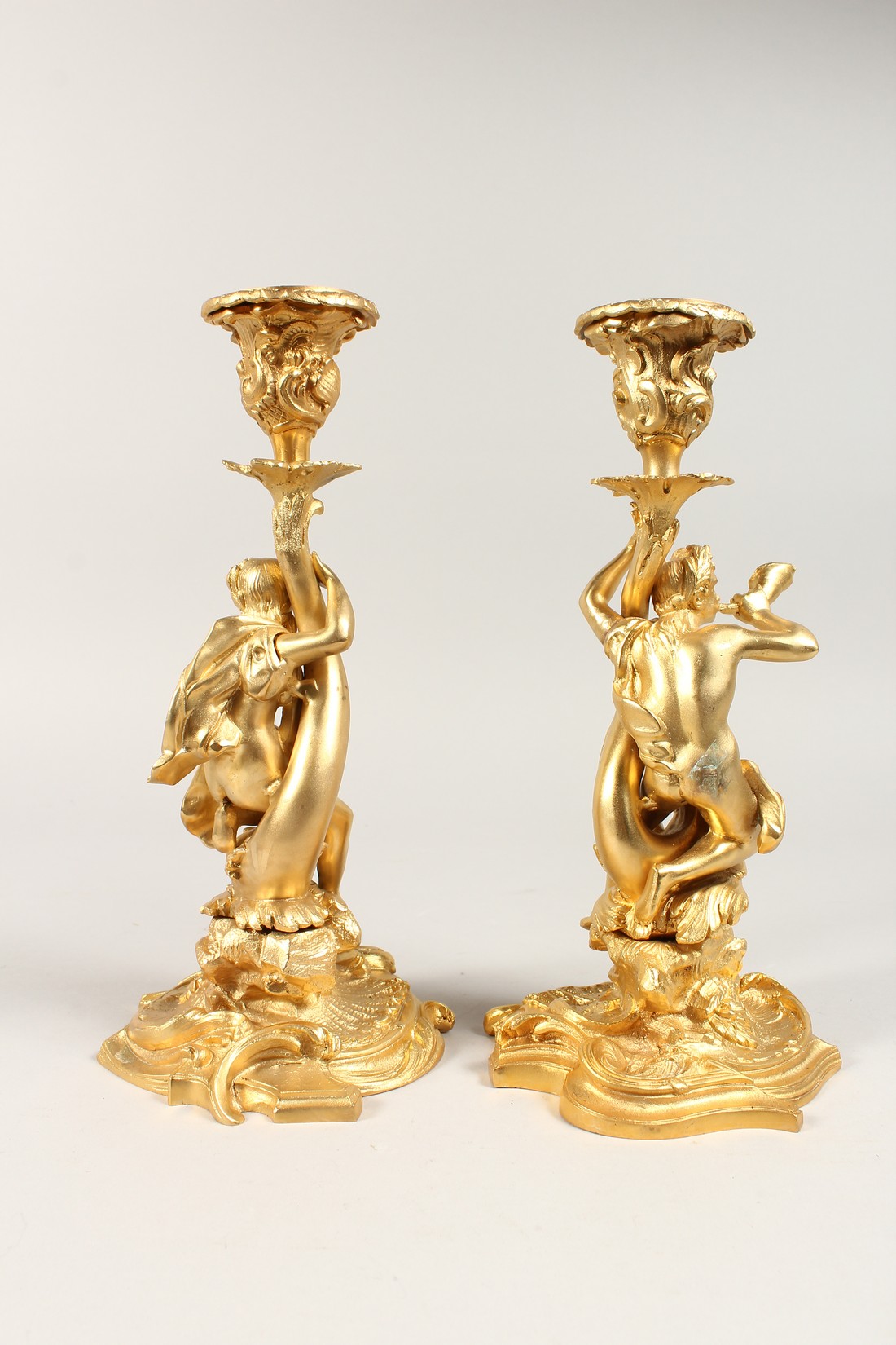 A GOOD PAIR OF GILT BRONZE CLASSICAL CANDLESTICKS on scrolled base. 11.5 ins tall - Image 2 of 2