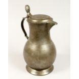 A FRENCH PEWTER LIDDED JUG 10ins high.