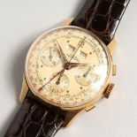 AN 18CT GUINAND 3 DIAL WRISTWATCH with leather strap. Possible a pilot's watch.
