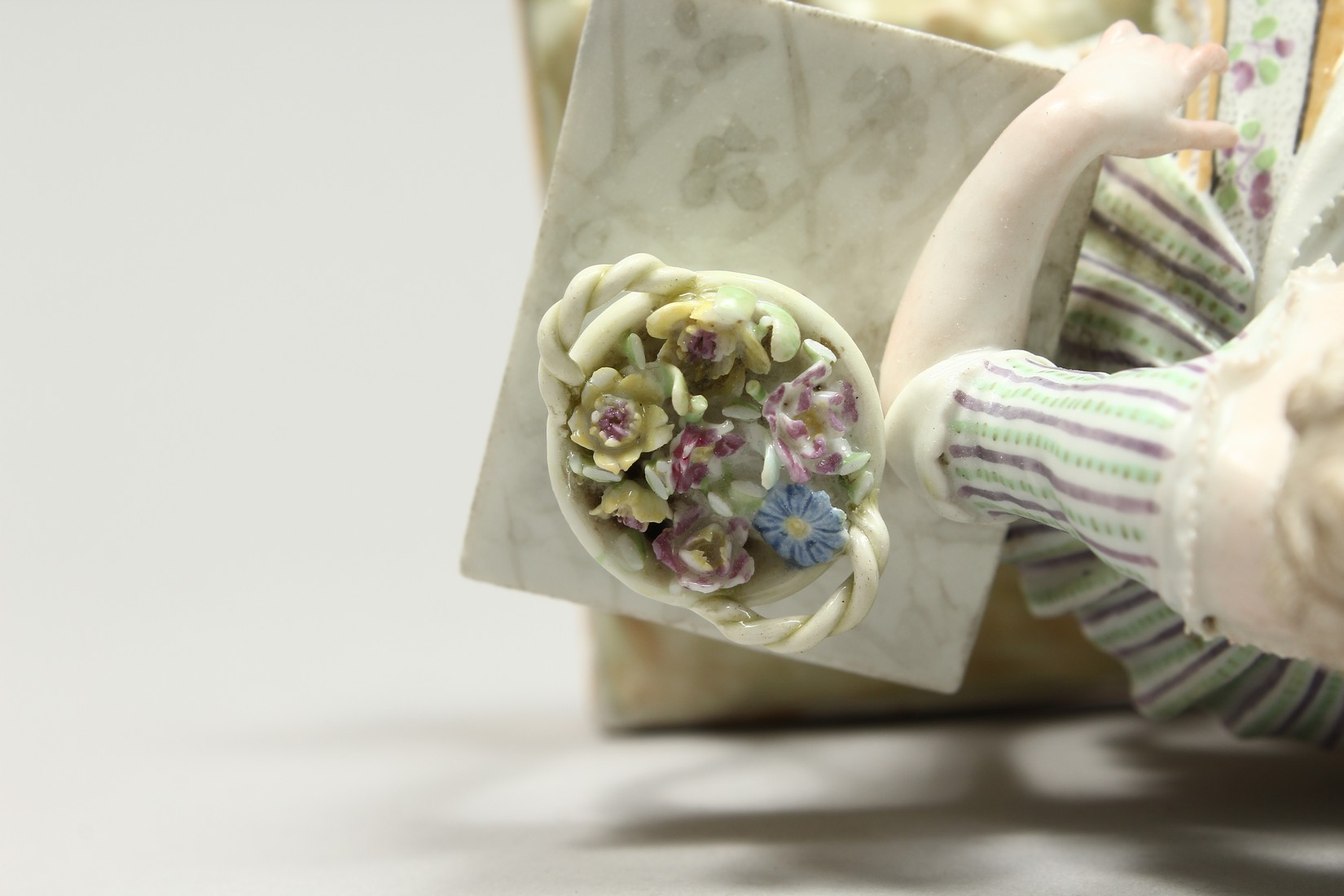 A GOOD MEISSEN PORCELAIN GROUP 'SENSE AND SMELL', a young lady sitting beside a table smelling - Image 7 of 13