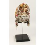 A PERUVIAN HEADRESS AND STAND