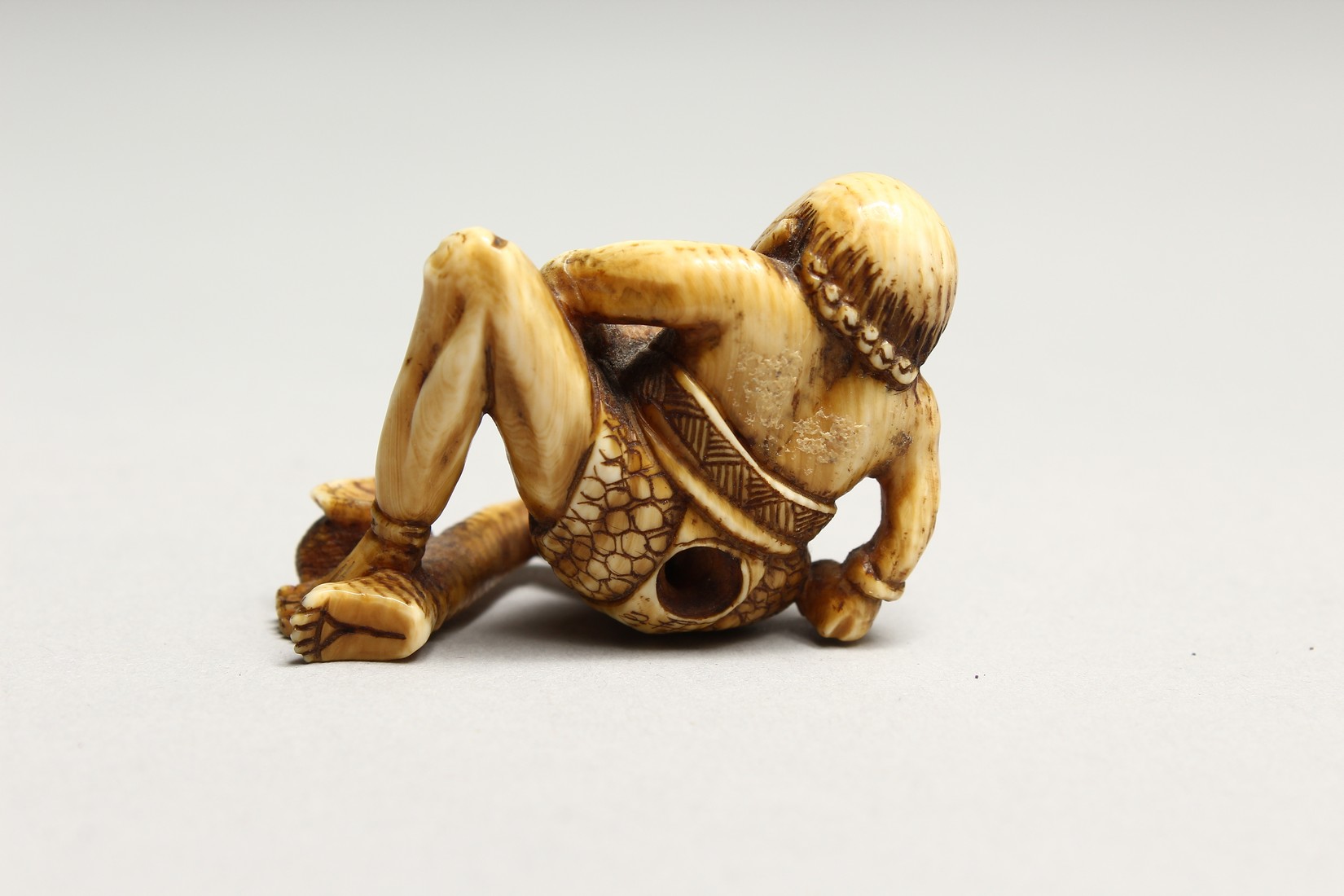 A CARVED BONE NETSUKE OF AN ONI 1.5ins - Image 3 of 6