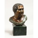 A SMALL ROMAN BUST 4.5ins high on a marble base.