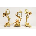 A GOOD FRENCH THREE PIECE ORMOLU CLOCK SET, with drum movement by DAI NIPPON, Paris, with acanthus