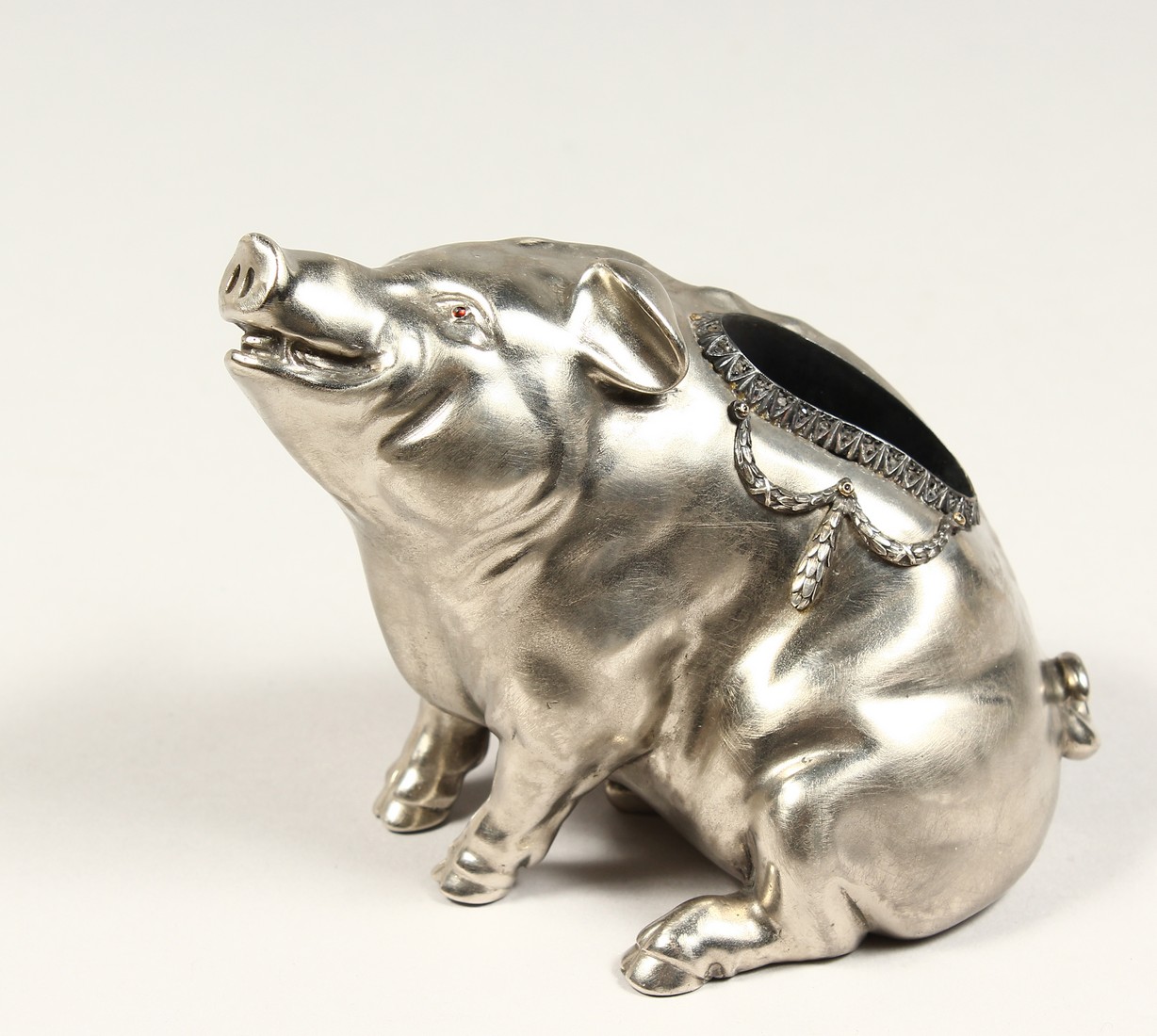A SUPERB RUSSIAN SILVER SEATED PIG MATCH HOLDER 3.75ins high, 4.5ins long With Faberge mark.