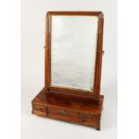 AN EARLY GEORGIAN MAHOGANY TOILET MIRROR, upright bevelled glass, the base with three drawers on