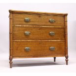 A GOOD MAHOGANY SATINWOOD THREE DRAWER COMMODE with crossbanded top, bamboo type column sides,