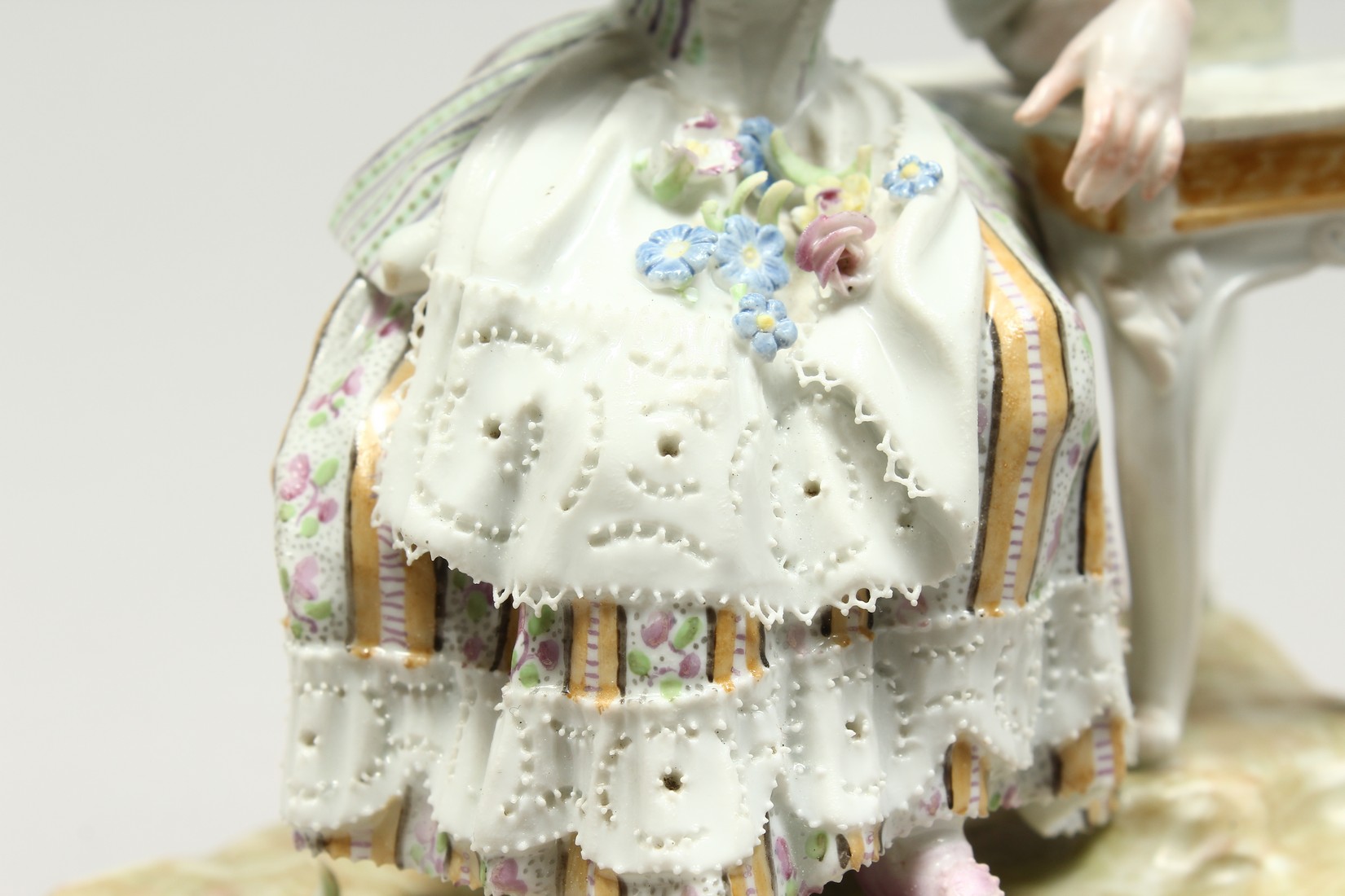 A GOOD MEISSEN PORCELAIN GROUP 'SENSE AND SMELL', a young lady sitting beside a table smelling - Image 11 of 13