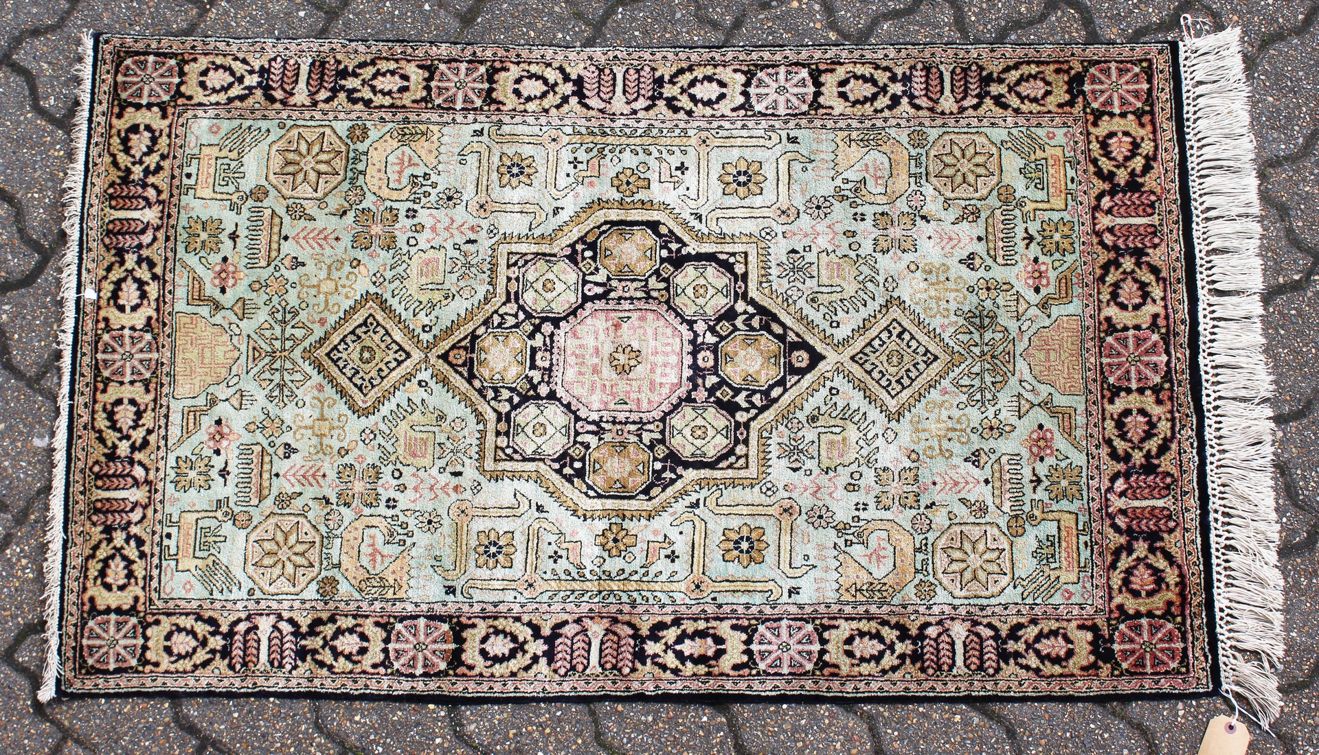 A SMALL PERSIAN PART SILK RUG. 4ft 4ins x 2ft 7ins.