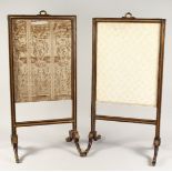 A PAIR OF GOOD QUALITY BRASS INLAID FIRE SCREENS on curving legs with brass feet. 2ft 10ins high x