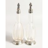 A VERY GOOD PAIR OF EUROPEAN SILVER MOUNTED ETCHED GLASS WINE AND WATER BOTTLES, the stoppers with