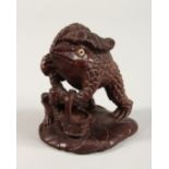 A JAPANESE CARVED GROUP OF TOADS 4ins high